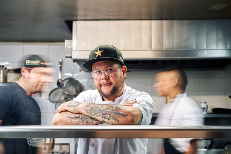 Dewey's pizza kitchen — artisan pizza being made by hand
