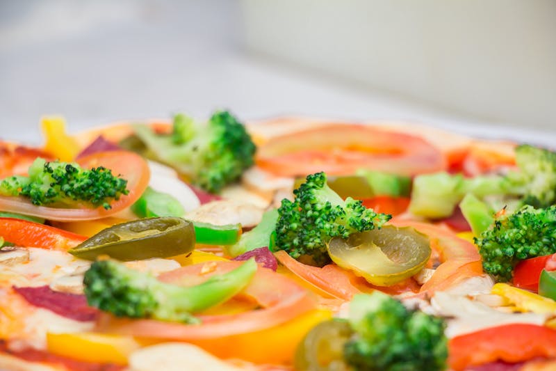 Pesto Primavera pizza with basil pesto and spring vegetables
