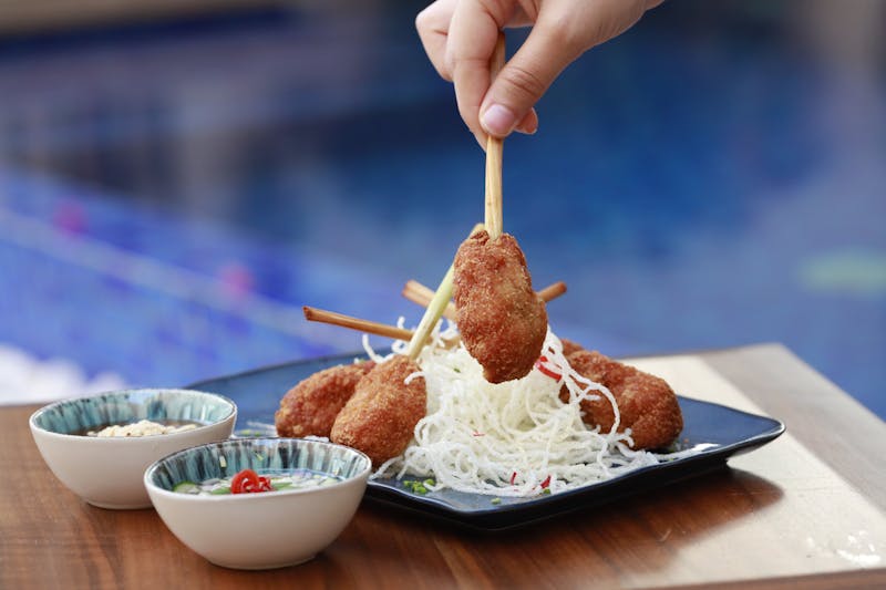 Golden fried mozzarella sticks with marinara sauce