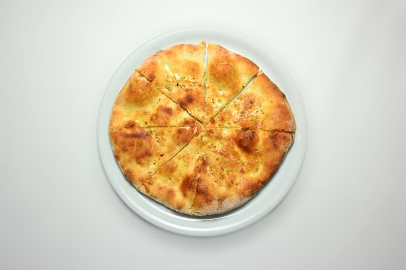 Herb breadsticks baked fresh with cheese