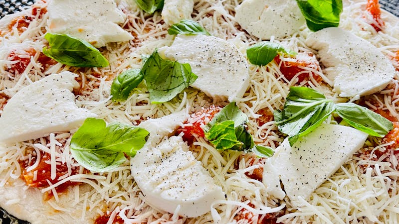 Classic Margherita pizza with fresh tomato and basil